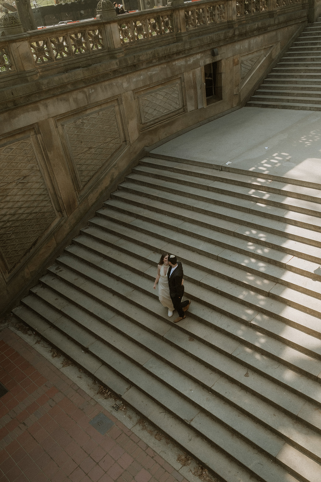 Wedding photographer captures couple under Bethesda Terrace arches New York City